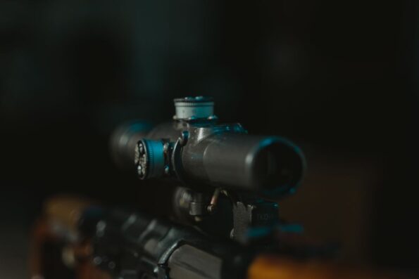 Close-up of rifle scope on firearm - scope buying guide
