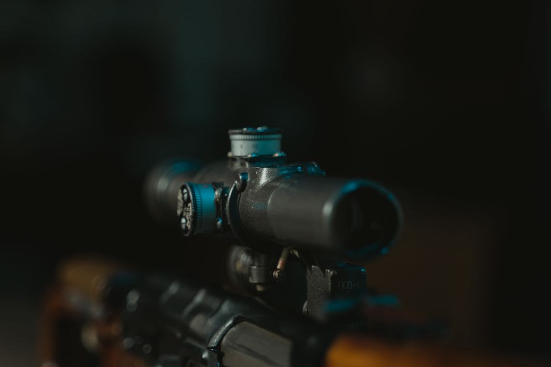 Close-up of rifle scope on firearm - scope buying guide