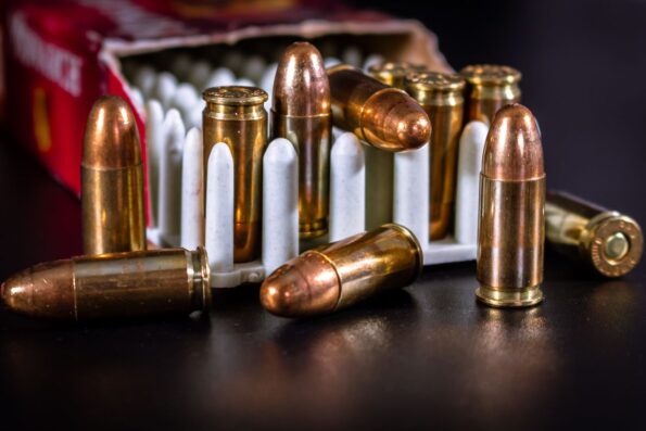 Close-up of copper bullets and cartridge cases - 9mm self-defense ammo